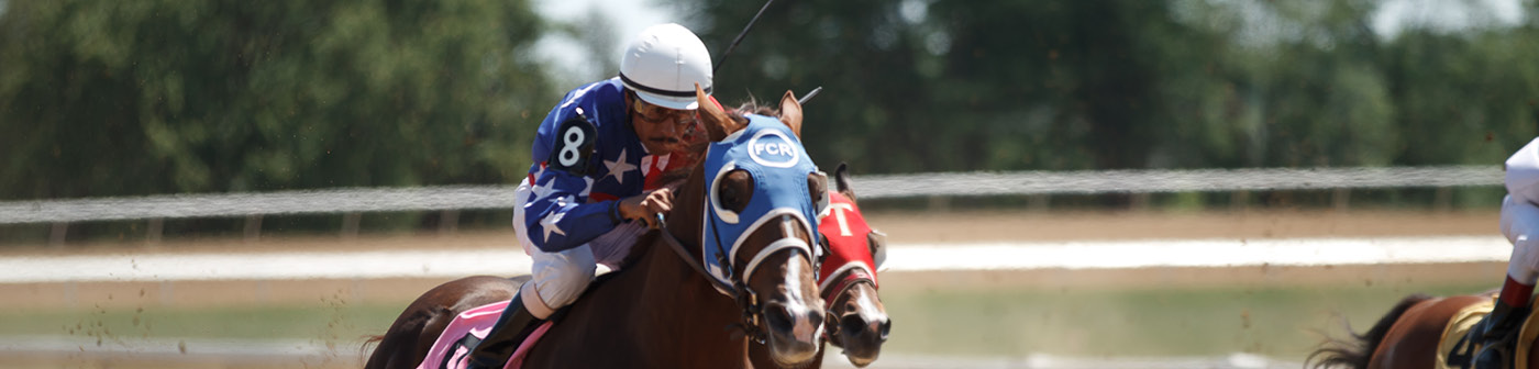 Horse jockey racing at Ajax Downs